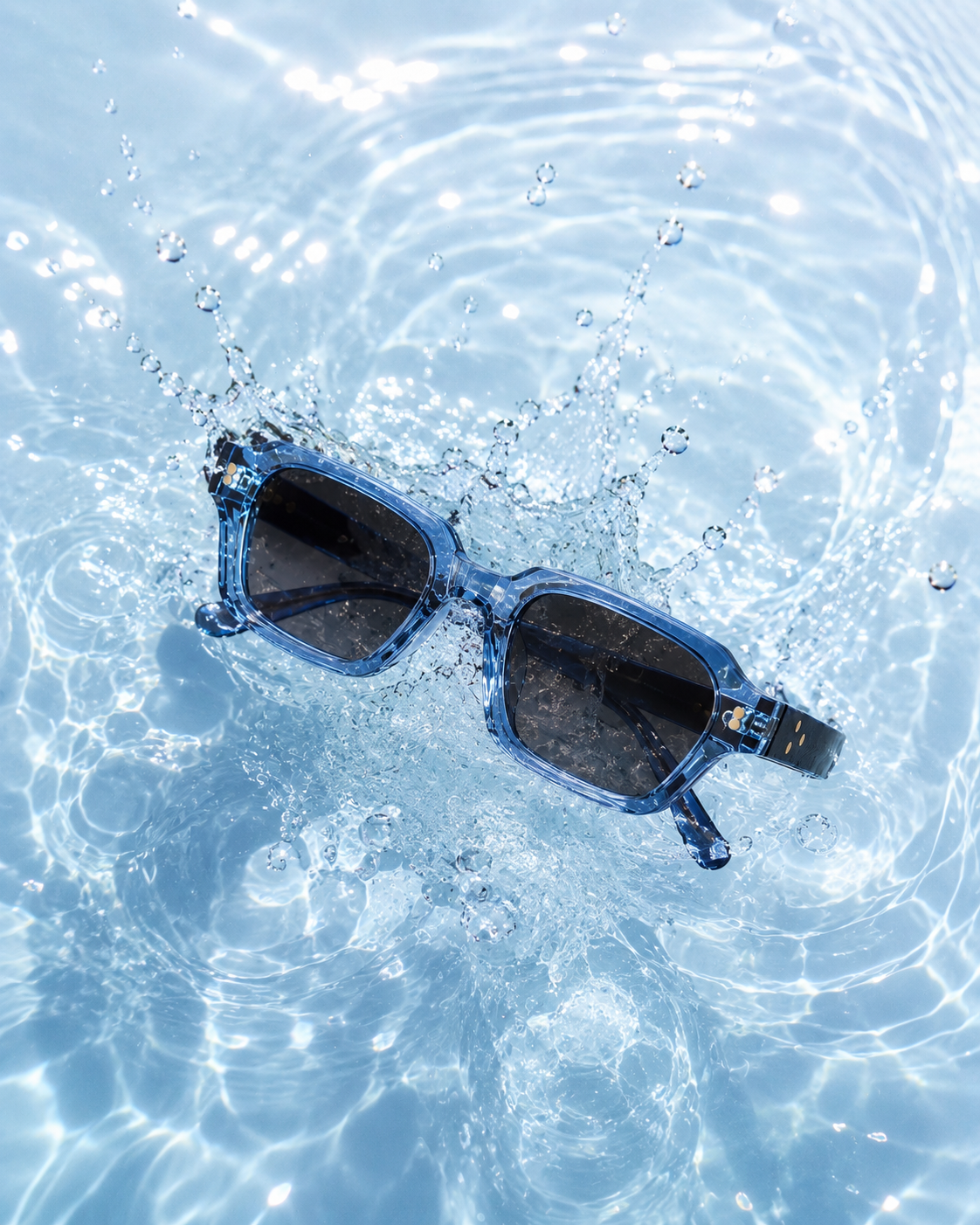 Mareframes blue sunglasses splashing in clear water